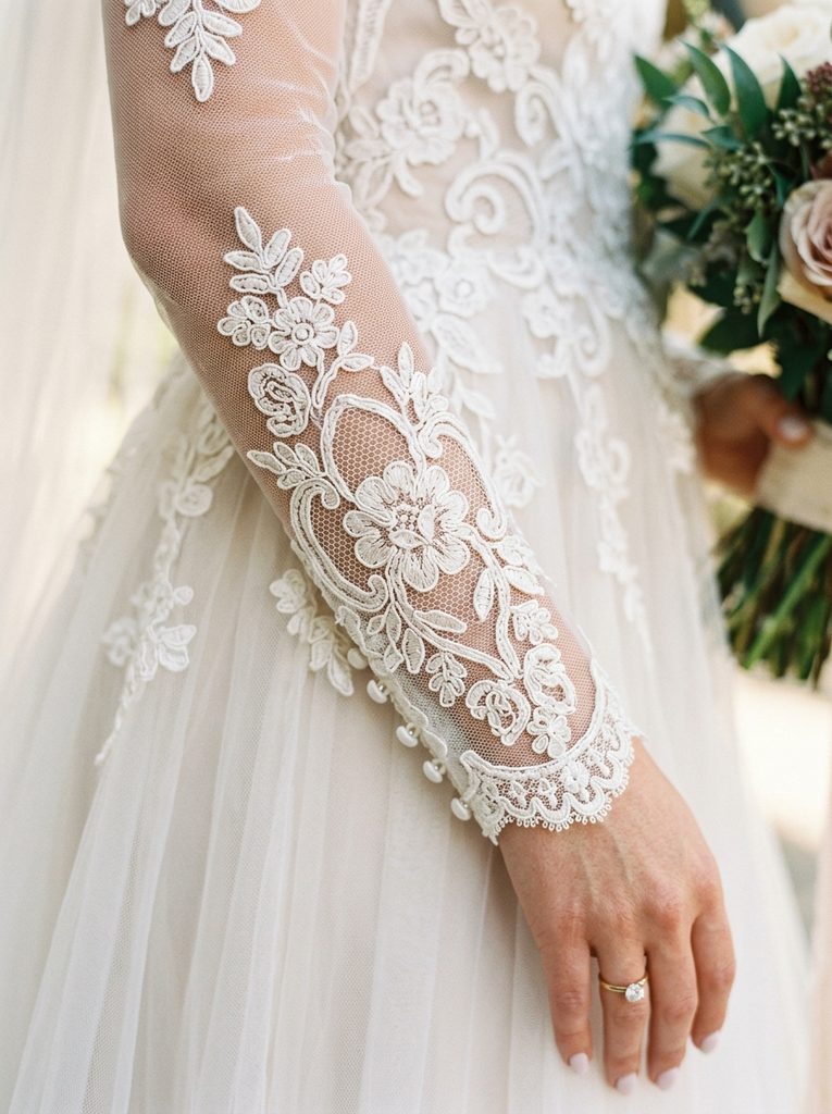 Close-up of Alençon lace detail on a wedding dress sleeve