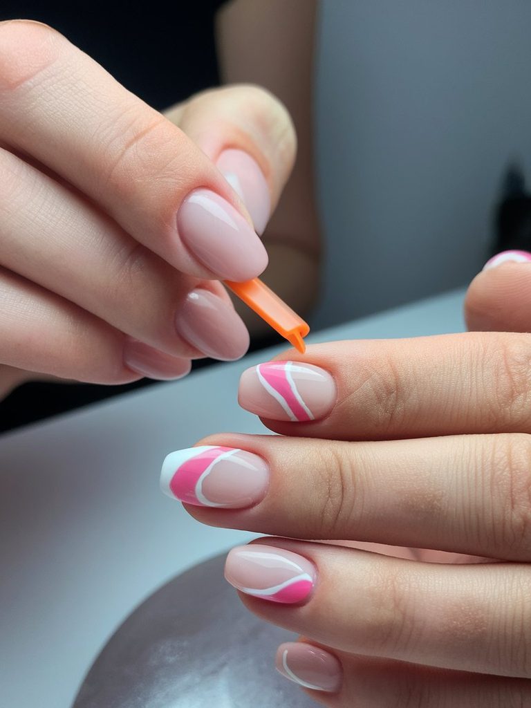 Nail technician applying a gel overlay with slight extension to a short nail