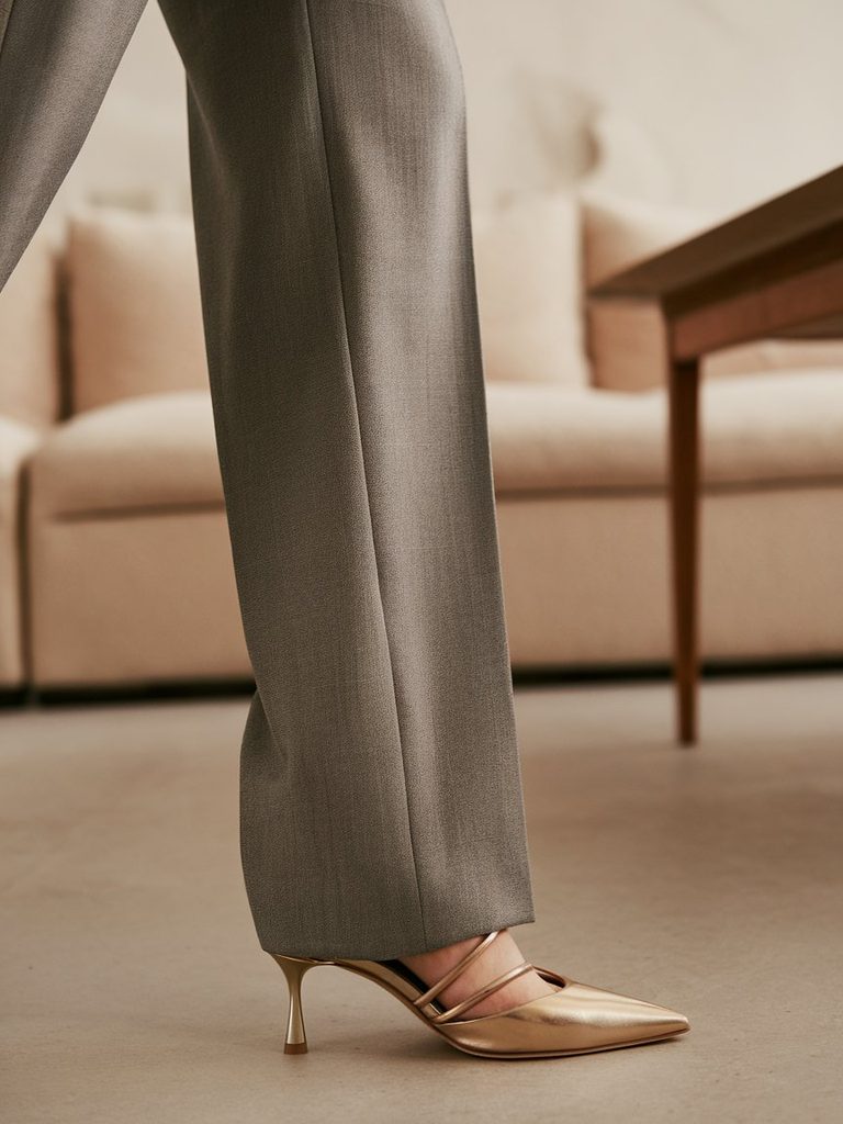 Pointed-toe and strappy heels styled with tailored trousers