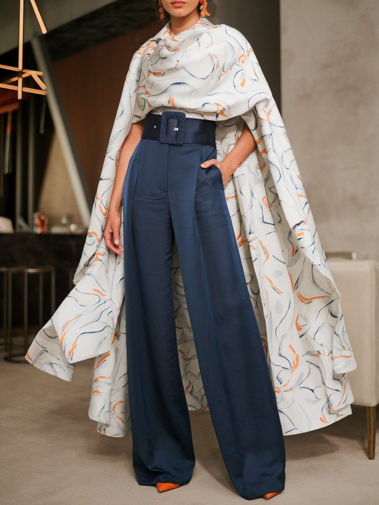 Silk wide-leg trousers paired with a draped blouse for cocktail attire